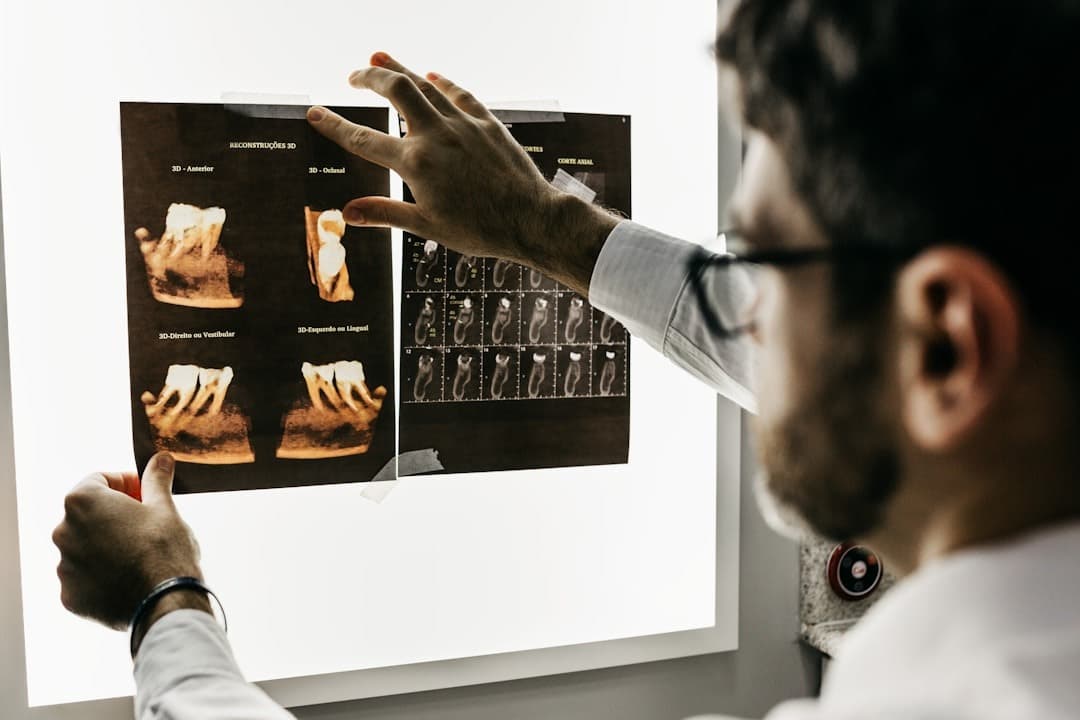 Dentist reviewing dental X-rays